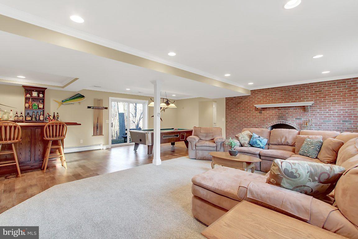 1446 Rock Ridge Road Jarrettsville, MD 21084 - Photo 22 of 30 Family Room in Basement with Wood Burning Fire