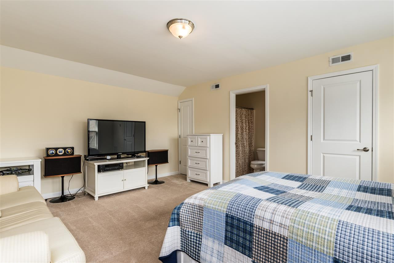 1413 Van Page Boulevard Raleigh, NC 27607 - Photo 22 of 25 ENJOY THIS FINISHED GARAGE BONUS ROOM FOR A HANG OUT SPACE OR AN EXTRA BEDROOM OR A HOME OFFICE. GARAGE BONUS ROOM