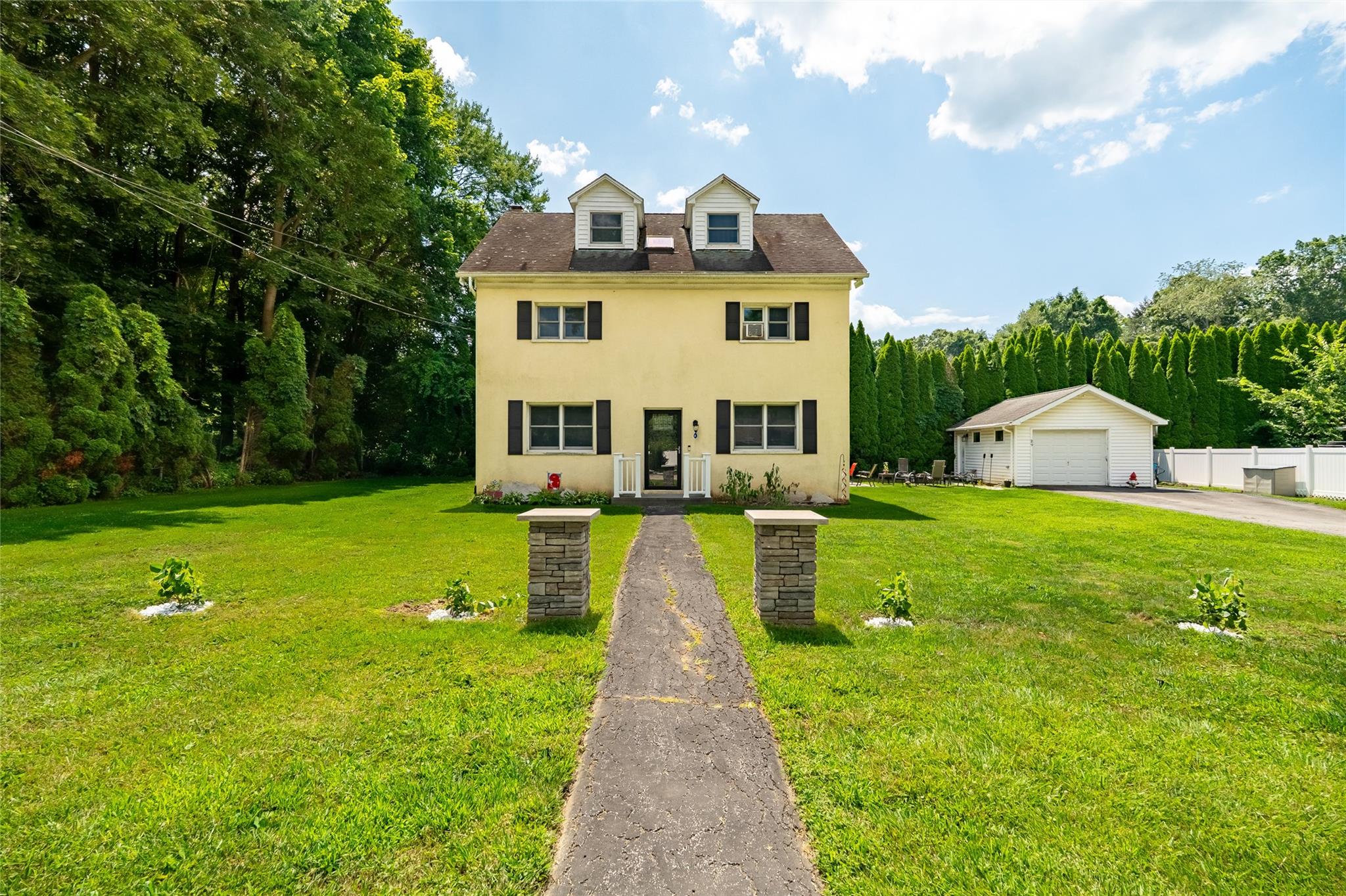 a front view of a house with garden