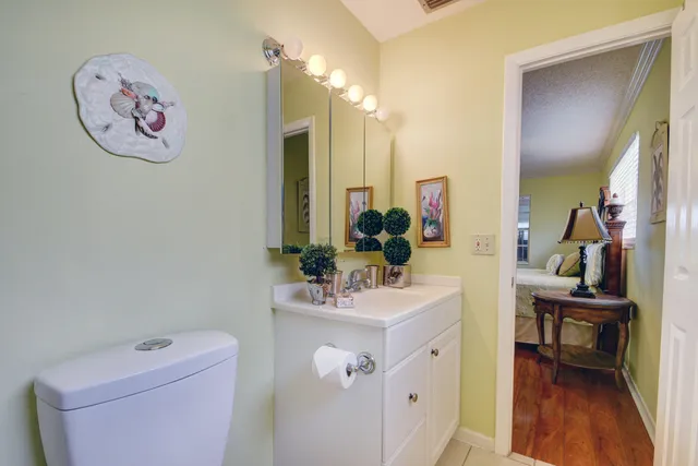 a view of bathroom with a sink and a mirror