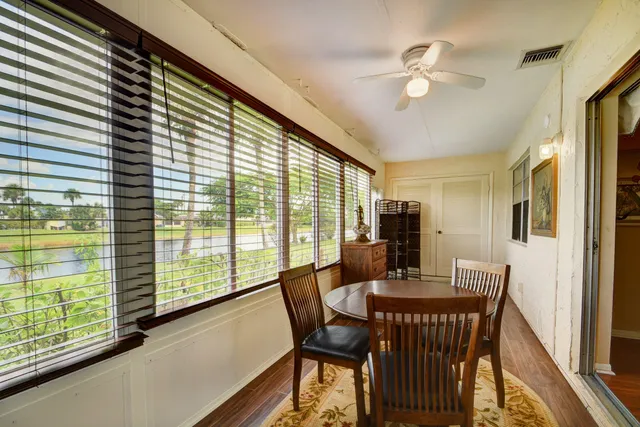 a view of a dining room with furniture window and outside view