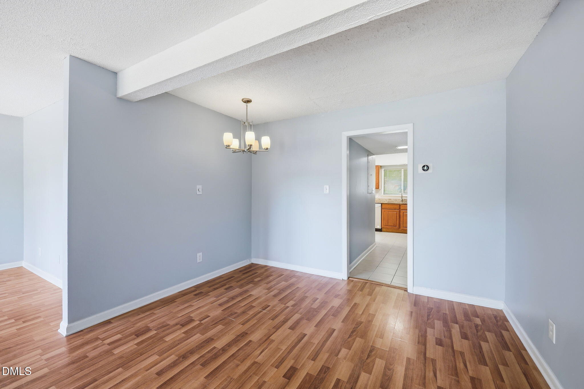 5043 Tall Pines Court Raleigh, NC 27609 - Photo 8 of 37 a view of empty room with wooden floor