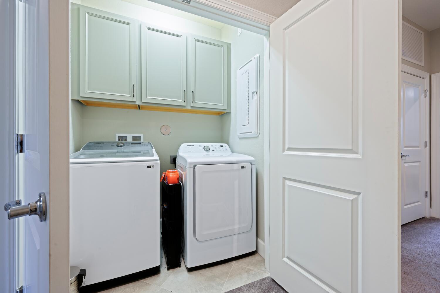 1832 Southeast Roxy Way Stuart, FL 34996 - Photo 15 of 17 a utility room with dryer and washer
