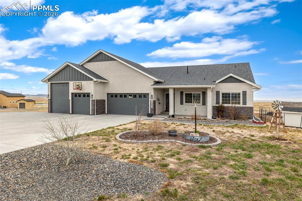 12095 Silver Concho Trail Elbert, CO 80106 - Photo 1 of 38 a front view of a house with a yard