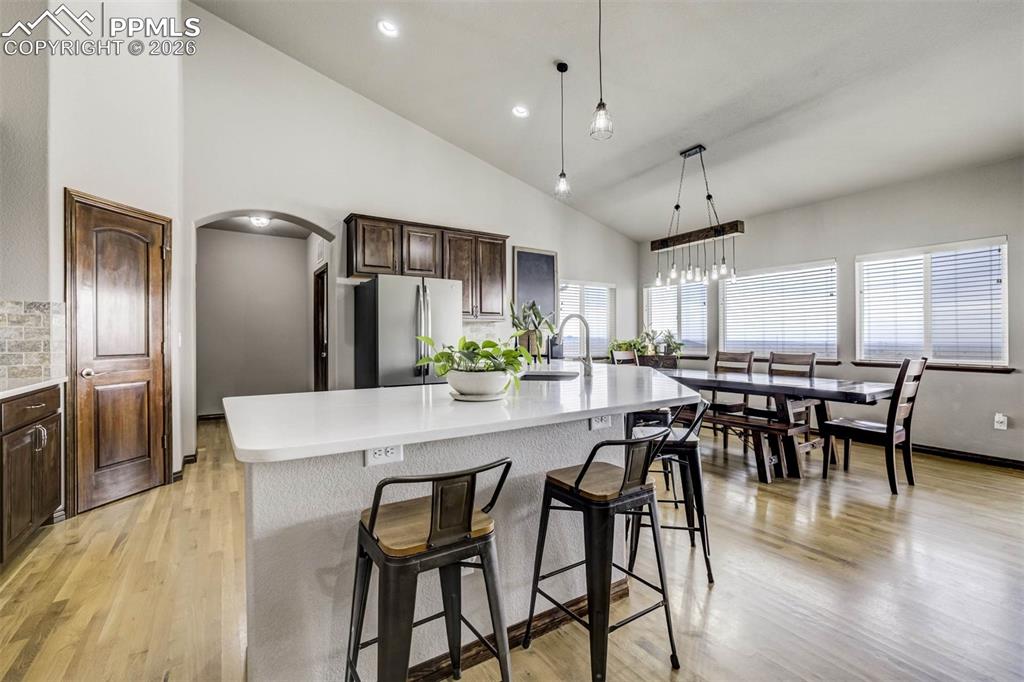 12095 Silver Concho Trail Elbert, CO 80106 - Photo 12 of 38 a kitchen with a table and chairs