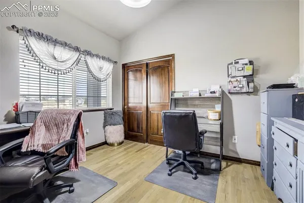a workspace with furniture and a window
