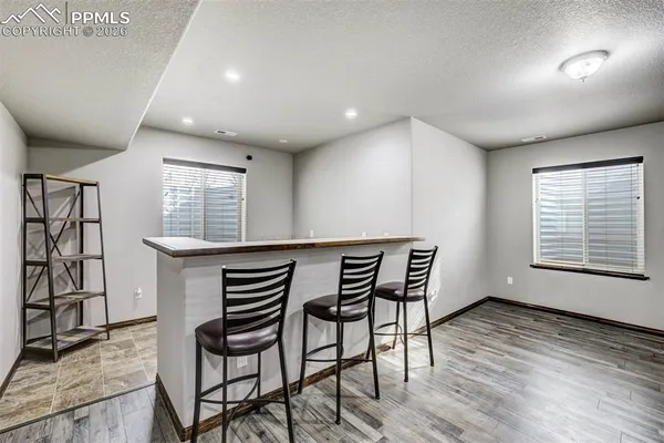 a view of an chairs and table in a room