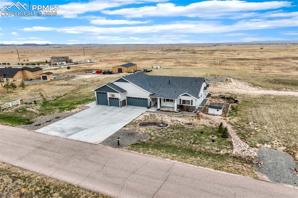12095 Silver Concho Trail Elbert, CO 80106 - Photo 3 of 38 a view of a terrace with wooden floor and city view
