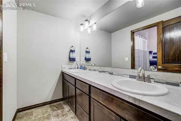 a bathroom with a sink and a mirror