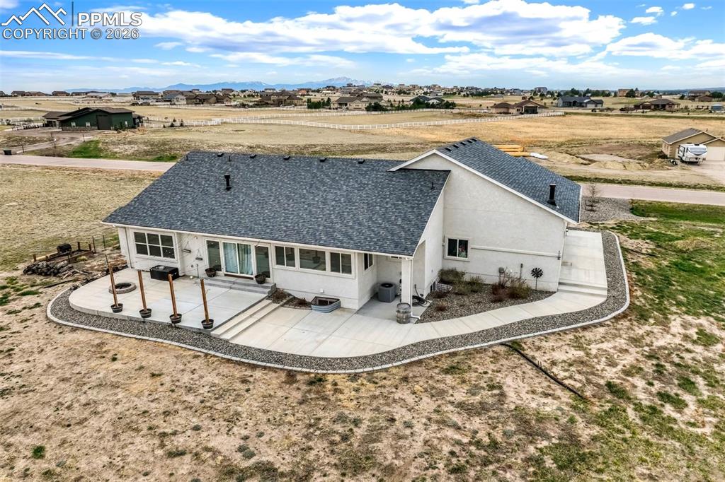 12095 Silver Concho Trail Elbert, CO 80106 - Photo 35 of 38 an aerial view of a house with a yard and ocean view