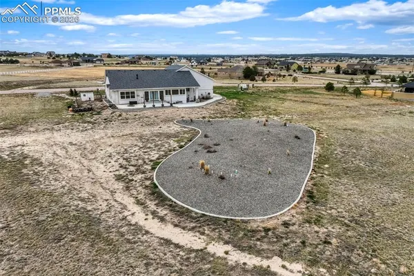 an aerial view of a house with a ocean view