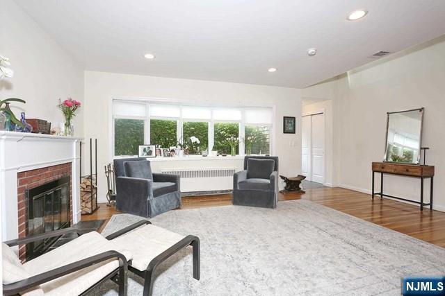 84 12th Street Cresskill, NJ 07626 - Photo 4 of 45 a living room with furniture and a fireplace