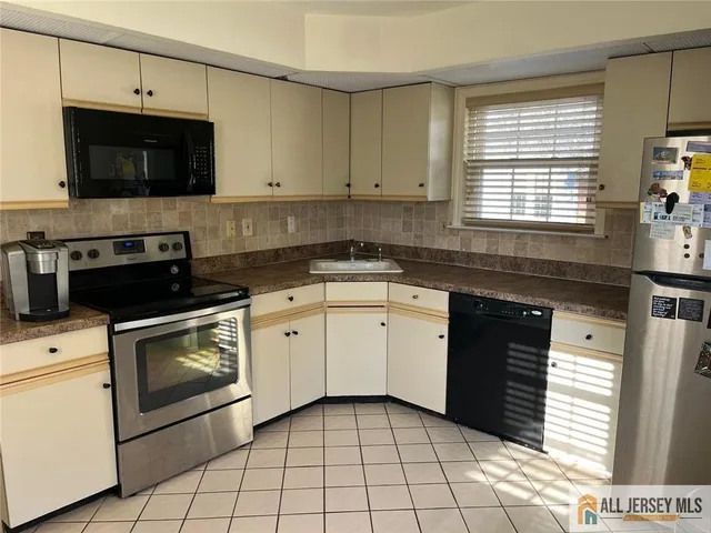 a kitchen with a stove and a sink