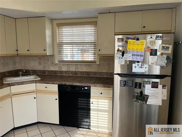 a kitchen with stainless steel appliances cabinets and a counter top space