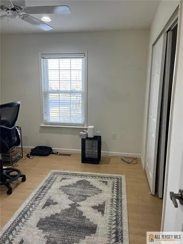 a room with a bed furniture and a window