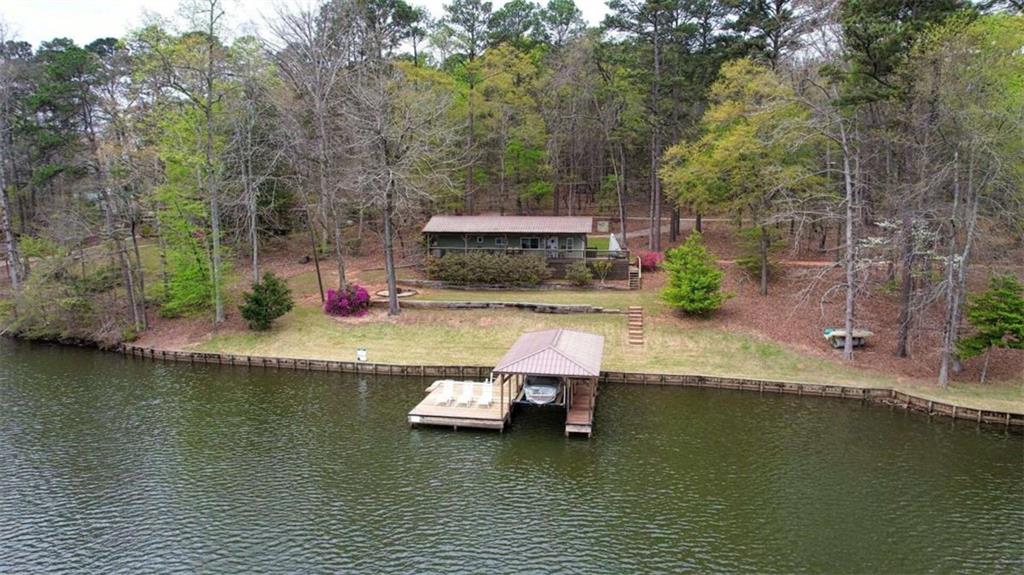 123 Copper Lane Mansfield, GA 30055 - Photo 13 of 43 an aerial view of a house with swimming pool and a yard