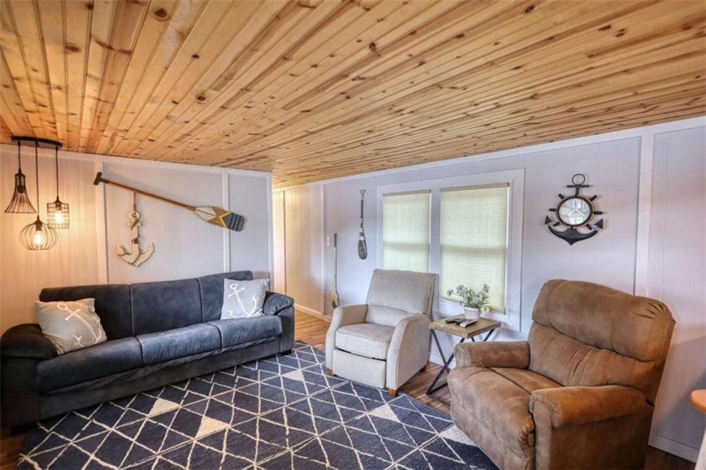 123 Copper Lane Mansfield, GA 30055 - Photo 14 of 43 a living room with furniture and a wooden floor