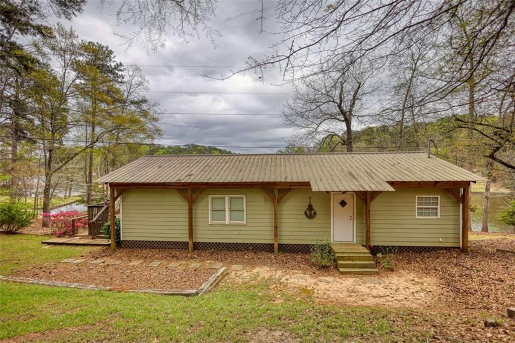123 Copper Lane Mansfield, GA 30055 - Photo 2 of 43 a front view of a house with a garden