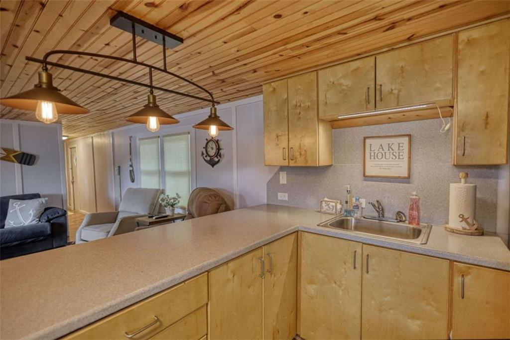 123 Copper Lane Mansfield, GA 30055 - Photo 21 of 43 a kitchen with a sink and cabinets