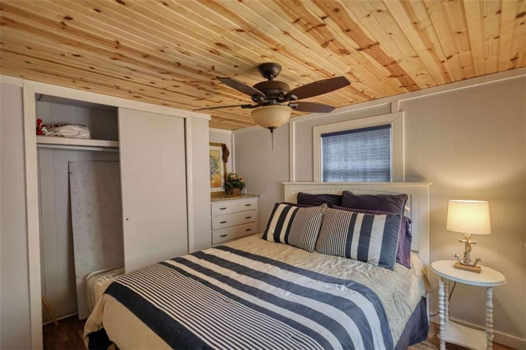 123 Copper Lane Mansfield, GA 30055 - Photo 23 of 43 a bedroom with a bed and a chandelier