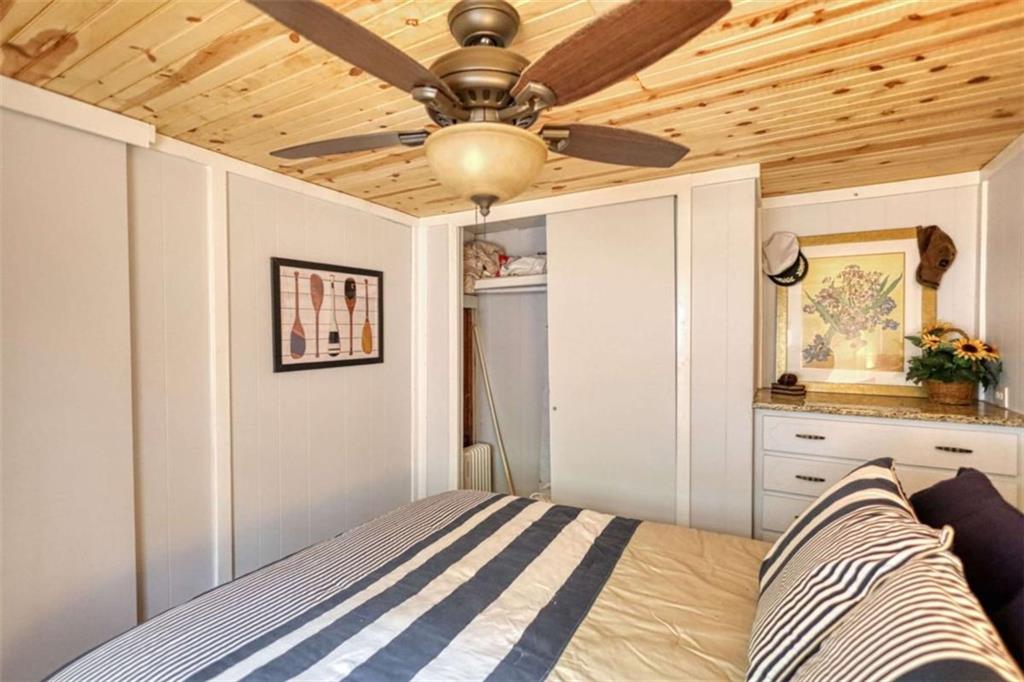 123 Copper Lane Mansfield, GA 30055 - Photo 24 of 43 a view of a bedroom with a bed and ceiling fan