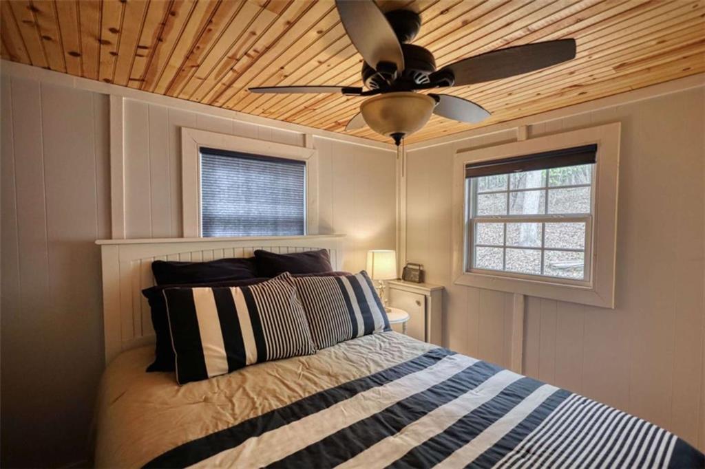 123 Copper Lane Mansfield, GA 30055 - Photo 25 of 43 a bedroom with a large bed and a window