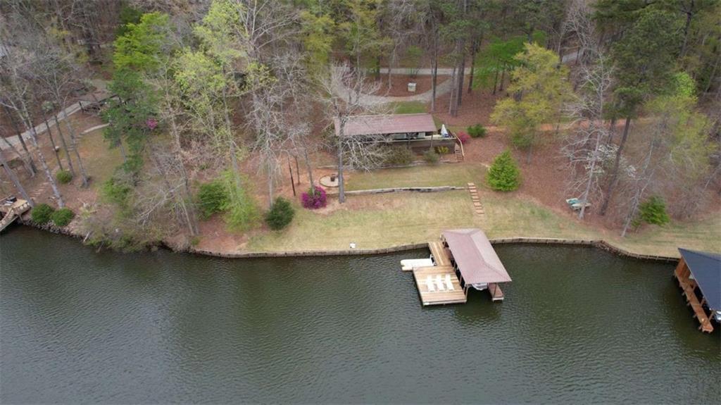 123 Copper Lane Mansfield, GA 30055 - Photo 36 of 43 an aerial view of a house with a yard and lake view