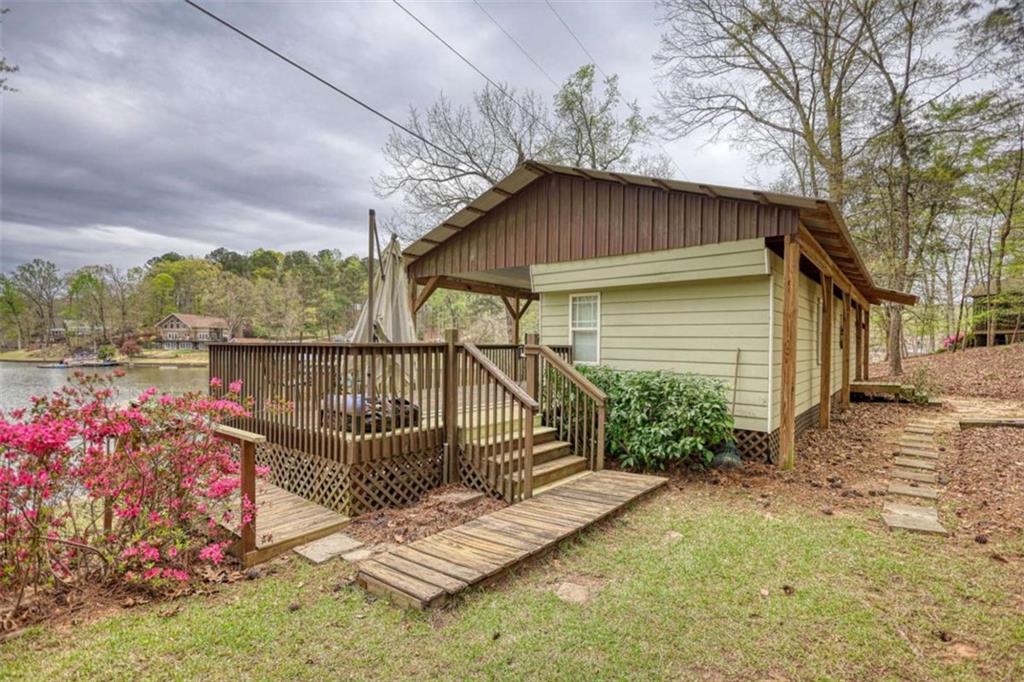 123 Copper Lane Mansfield, GA 30055 - Photo 5 of 43 a view of deck with wooden floor and fence