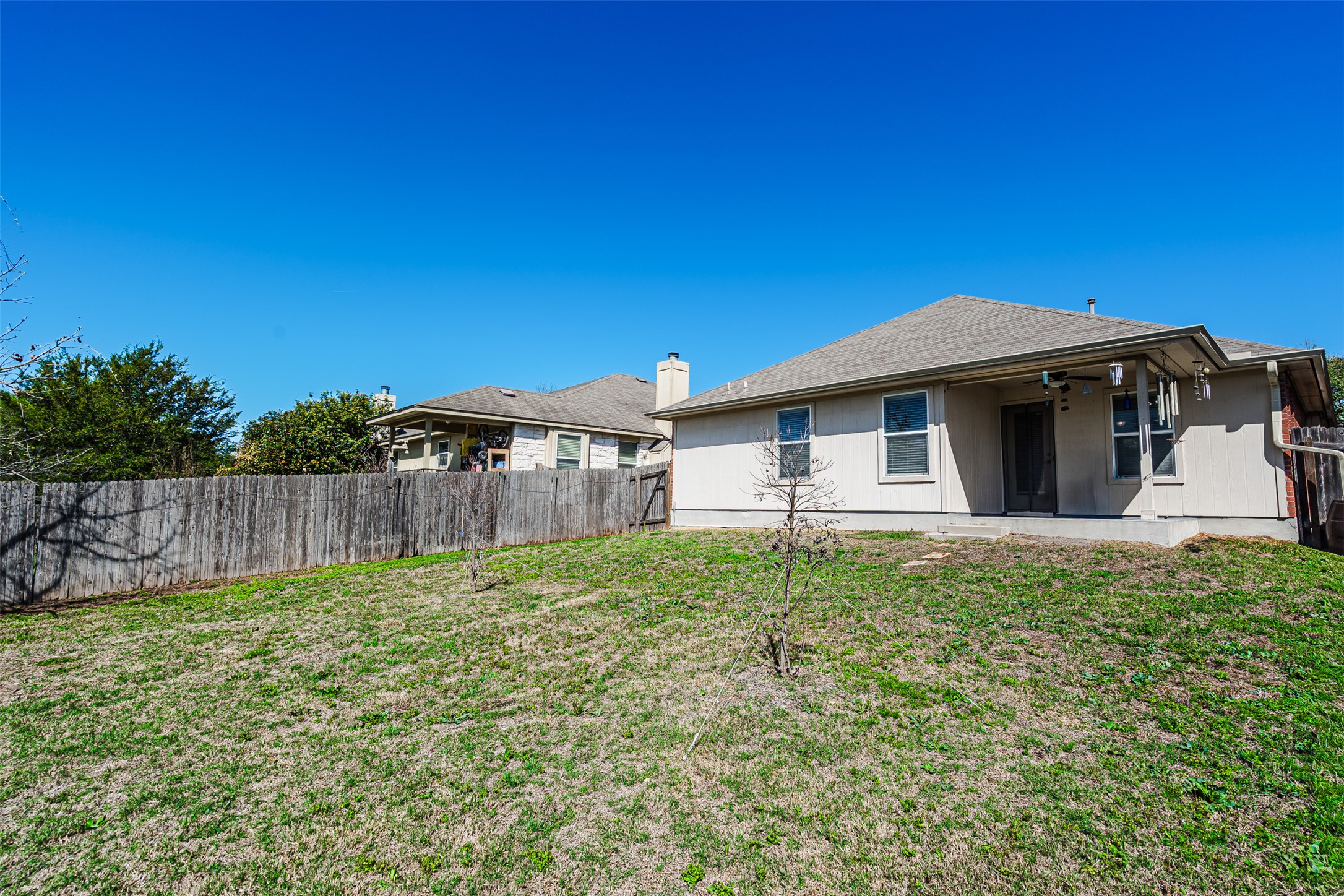 2404 Christoff Loop Austin, TX 78748 - Photo 19 of 24 Rear view of property featuring a fenced backyard and a patio area