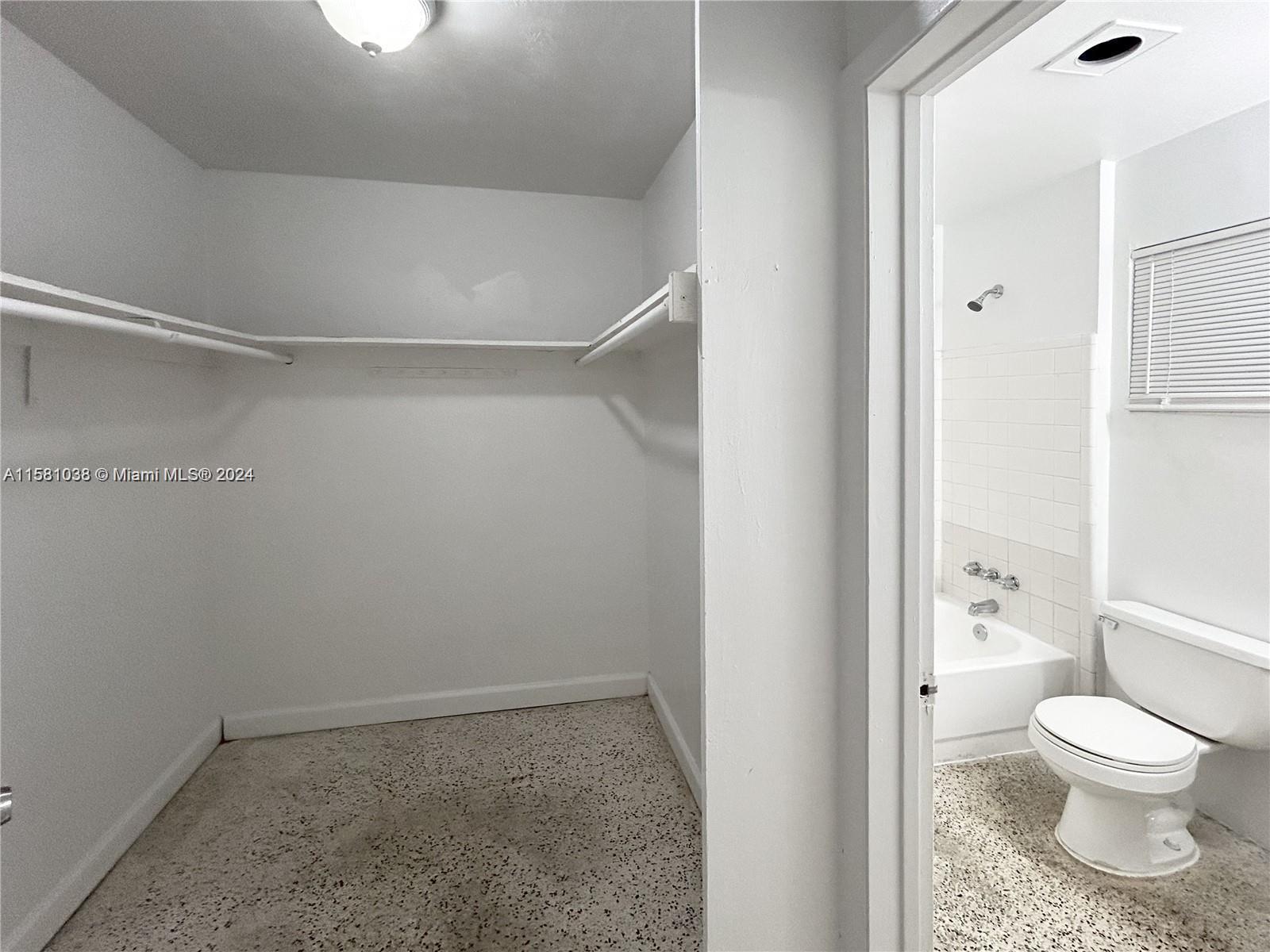 699 Northeast 86th Street, Unit 2 Miami, FL 33138 - Photo 8 of 12 a bathroom with a toilet and a shower