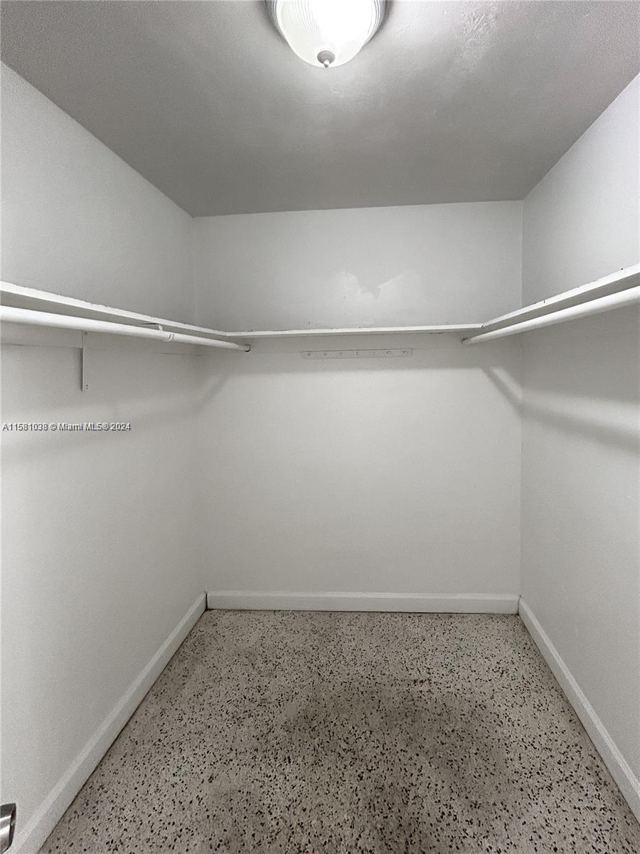699 Northeast 86th Street, Unit 2 Miami, FL 33138 - Photo 9 of 12 a empty closet with white paint