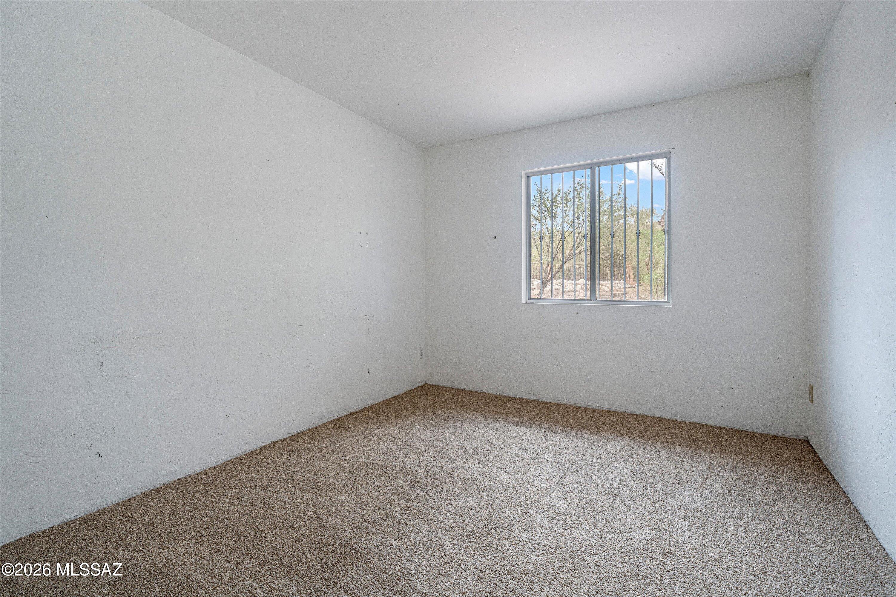 10961 East Roger Road Tucson, AZ 85749 - Photo 41 of 45 2nd bedroom overlooking pool