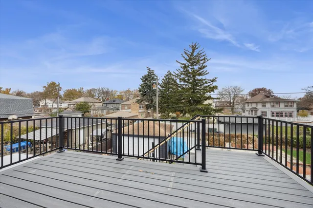 a view of balcony with wooden floor and city view