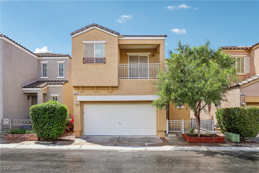 7331 Carrot Ridge Street Las Vegas, NV 89139 - Photo 1 of 28 View of property featuring an attached garage, a t