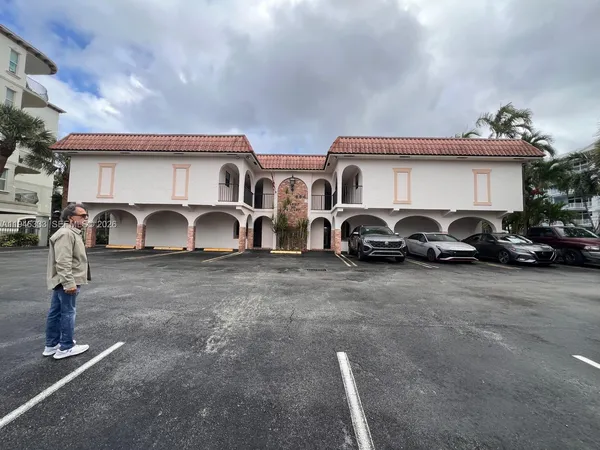 a front view of a house with parking area