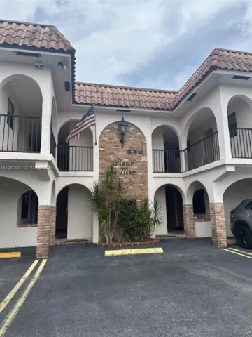 a front view of a house with a garage