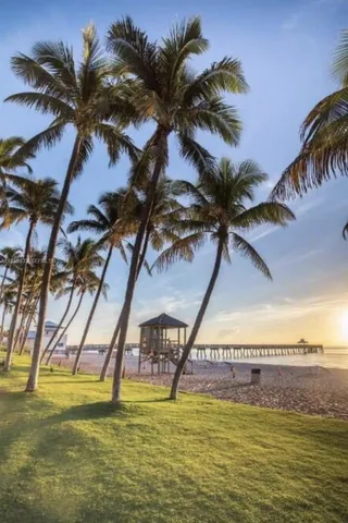 a view of a swimming pool with a table and chairs