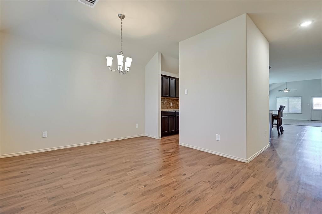 1415 Rodeo Cattle Lane Houston, TX 77049 - Photo 5 of 18 wooden floor in an empty room with a window