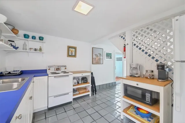 a utility room with cabinets dryer and washer
