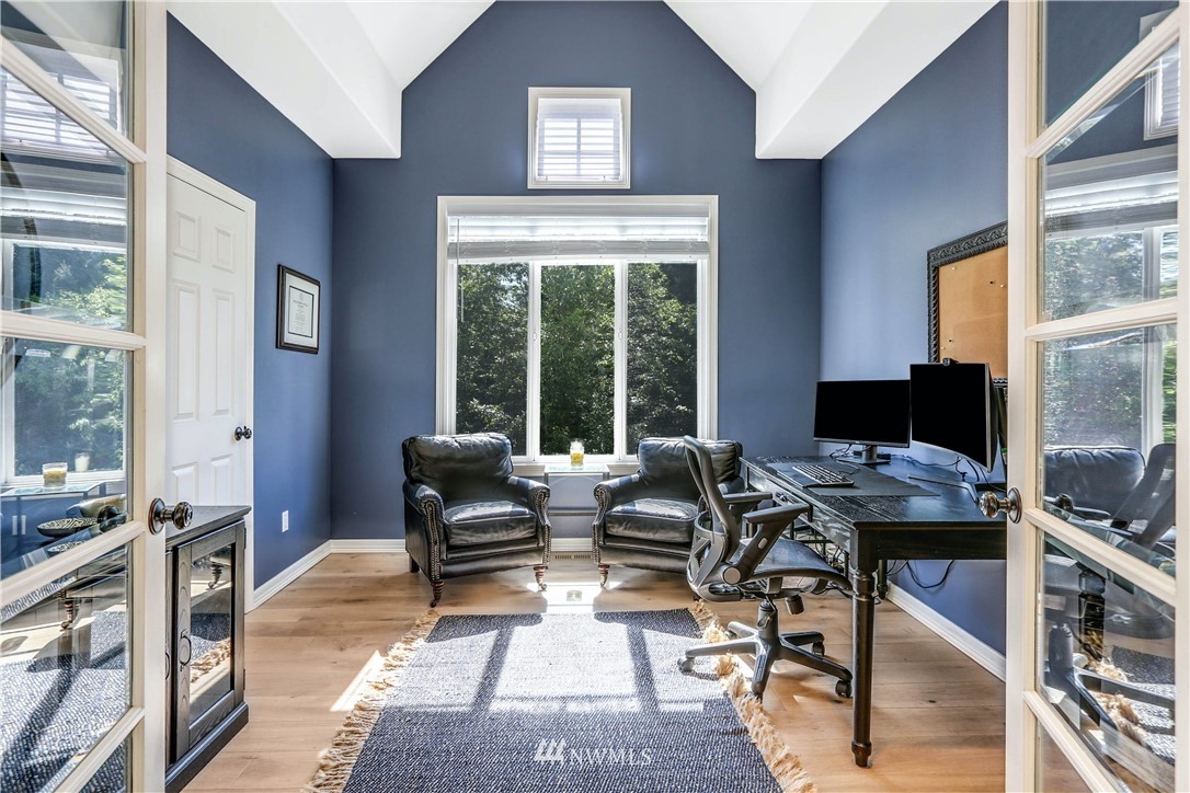 17124 Southeast 100th Street Renton, WA 98059 - Photo 11 of 40 a living room with furniture and large windows