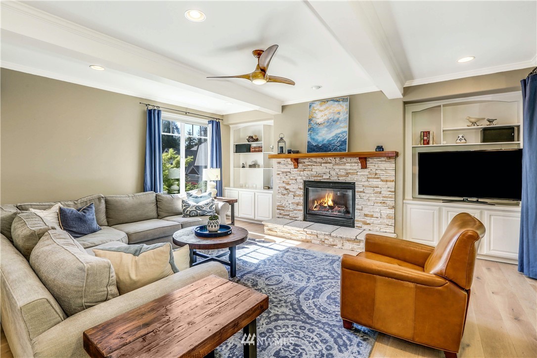 17124 Southeast 100th Street Renton, WA 98059 - Photo 13 of 40 a living room with furniture and a fireplace
