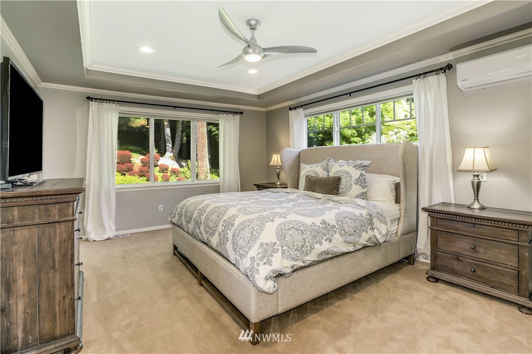 17124 Southeast 100th Street Renton, WA 98059 - Photo 18 of 40 a bedroom with a bed dresser and a large window