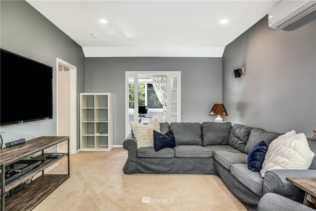 17124 Southeast 100th Street Renton, WA 98059 - Photo 26 of 40 a living room with furniture and a flat screen tv