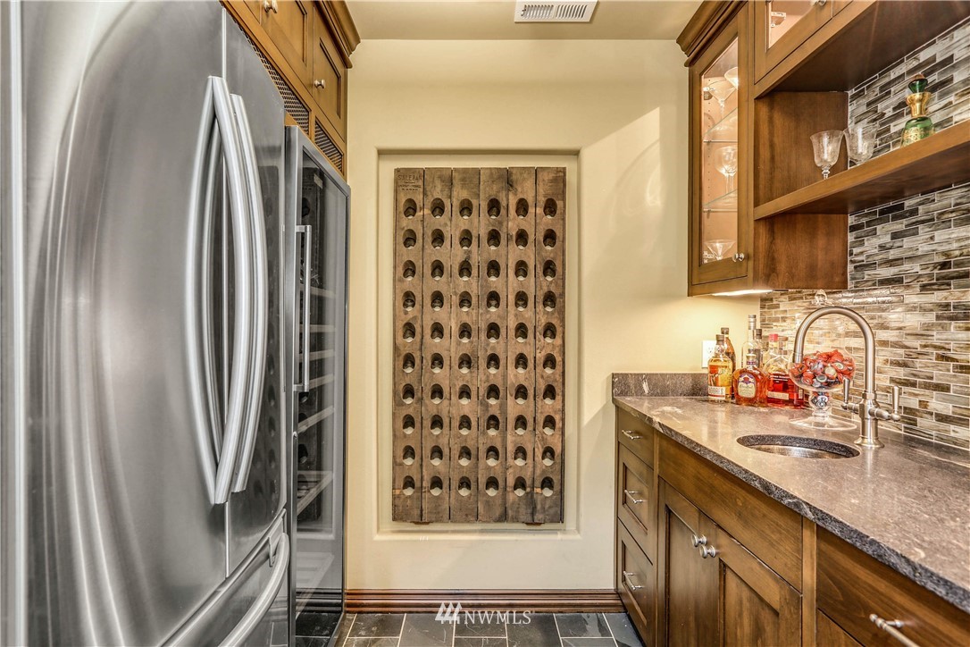 17124 Southeast 100th Street Renton, WA 98059 - Photo 29 of 40 a kitchen with a refrigerator and a sink