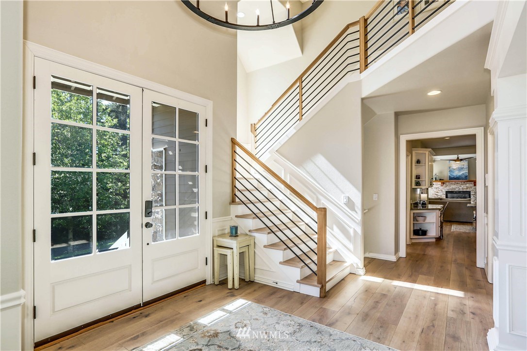17124 Southeast 100th Street Renton, WA 98059 - Photo 4 of 40 a view of an entryway with wooden floor and windows