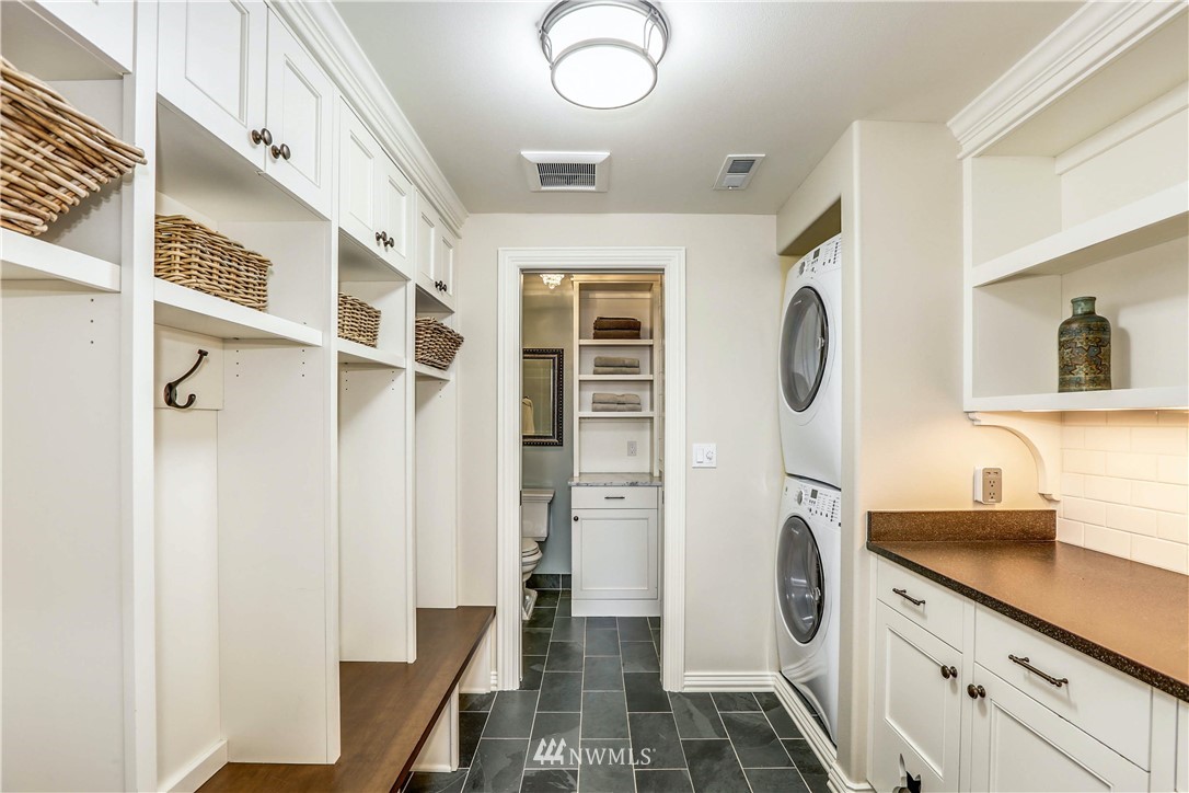 17124 Southeast 100th Street Renton, WA 98059 - Photo 31 of 40 a view of a hallway with washer and dryer