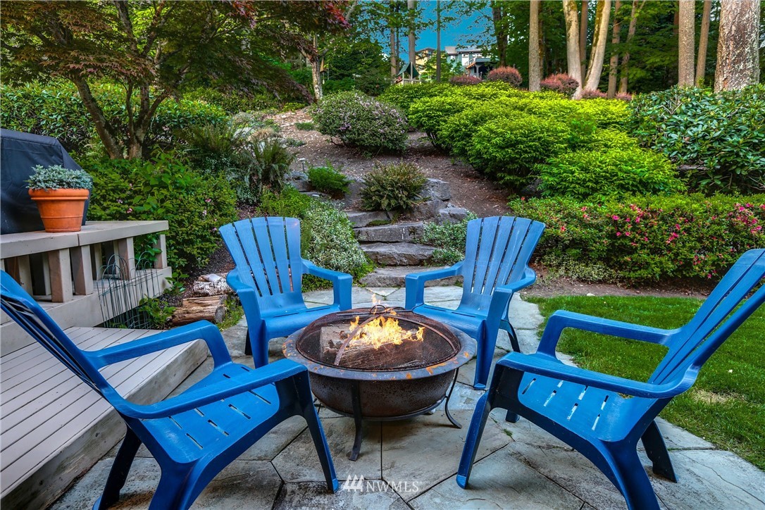 17124 Southeast 100th Street Renton, WA 98059 - Photo 38 of 40 a view of a chairs and table in backyard of the house