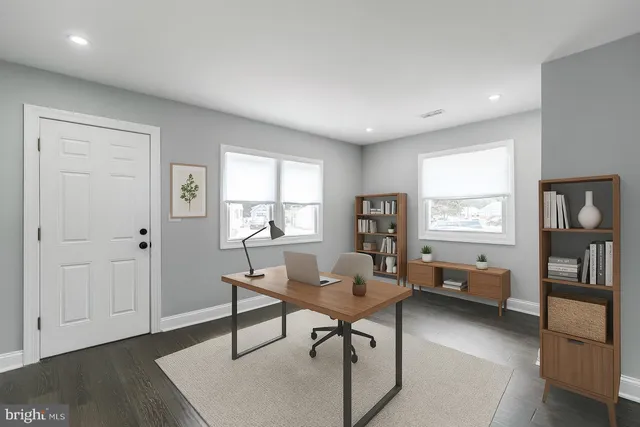 a workspace with furniture and window