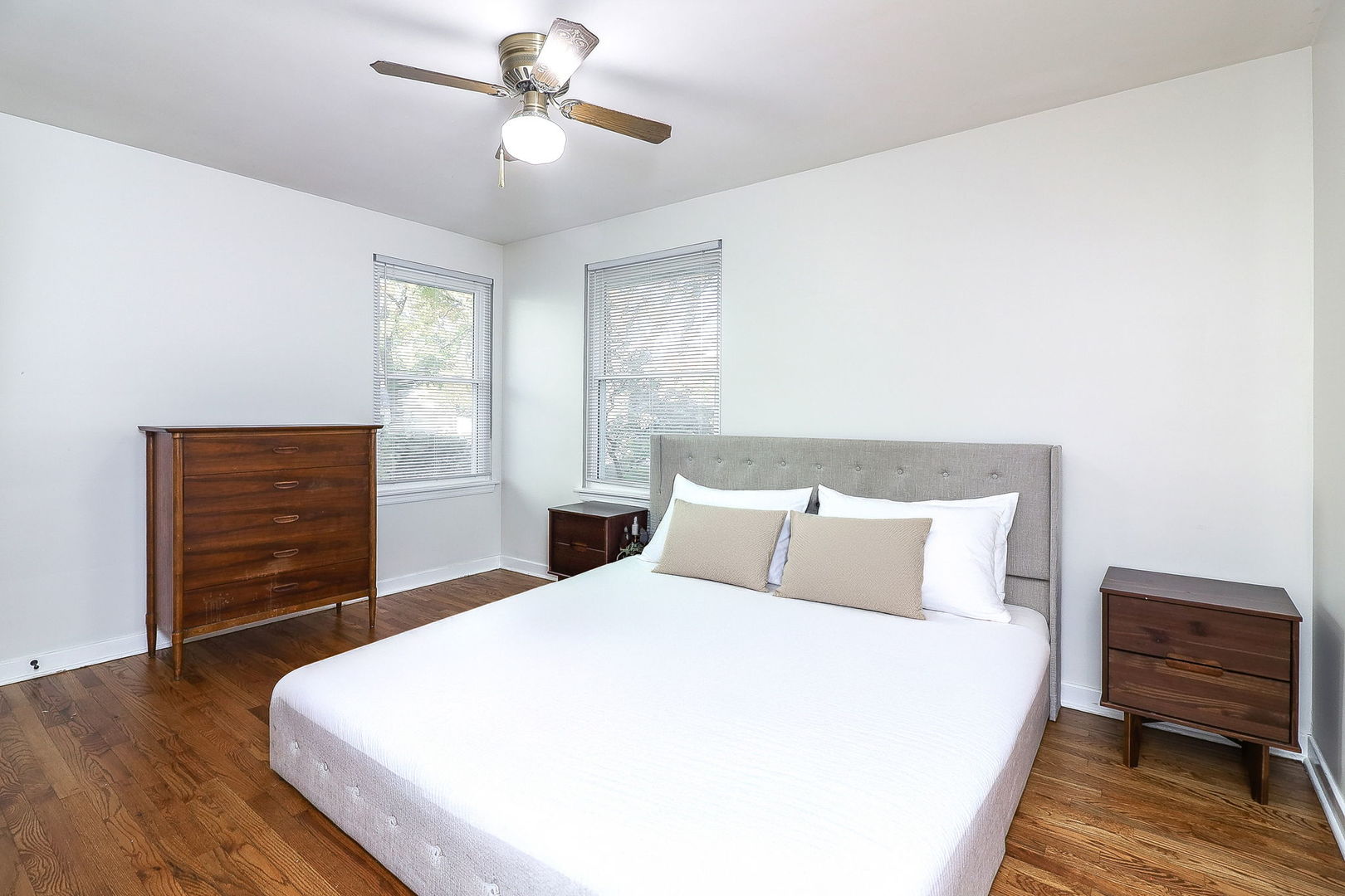 3210 Madison Avenue Brookfield, IL 60513 - Photo 11 of 27 a bedroom with a bed and wooden floor