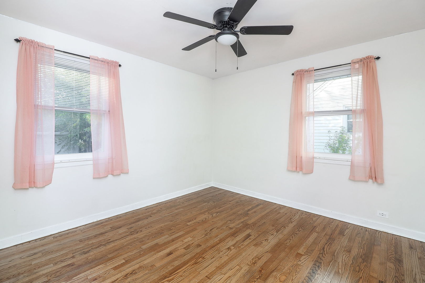 3210 Madison Avenue Brookfield, IL 60513 - Photo 12 of 27 a view of empty room with wooden floor and fan